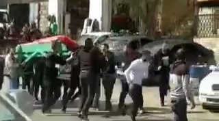 Occupation soldiers attack a funeral procession at the entrance to the town of Beit Ummar