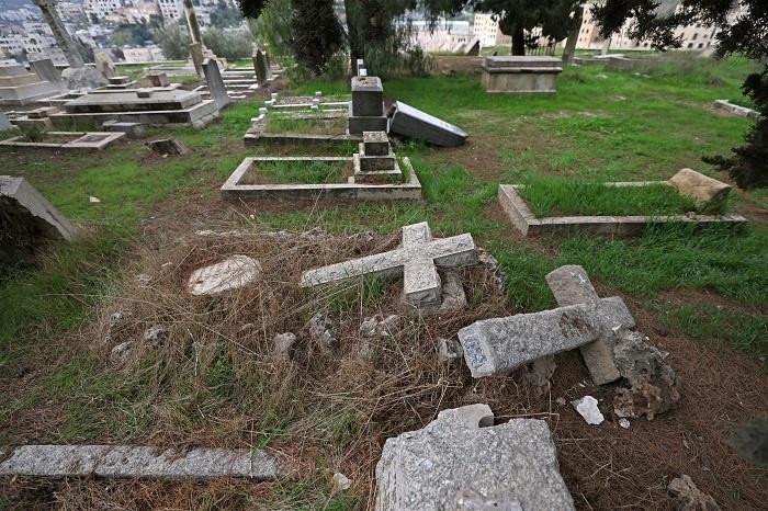 Occupation police arrest settlers after vandalizing the Protestant cemetery