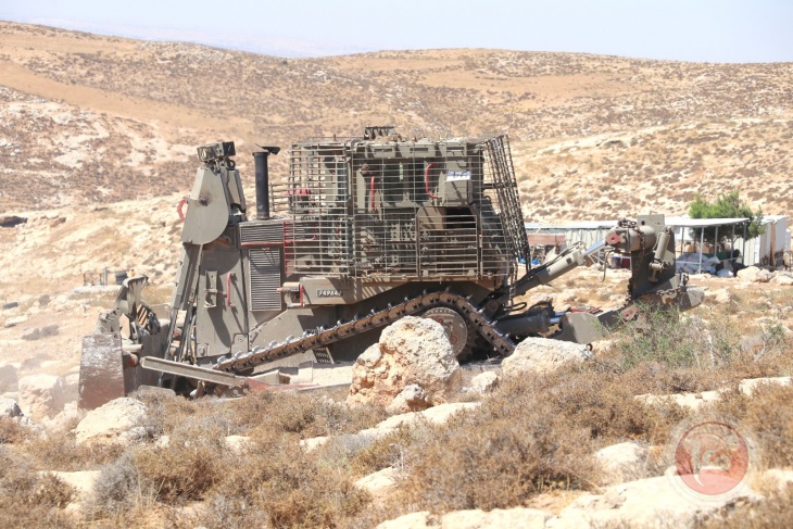 The occupation bulldozes an agricultural road south of Hebron to expand the borders of two settlements