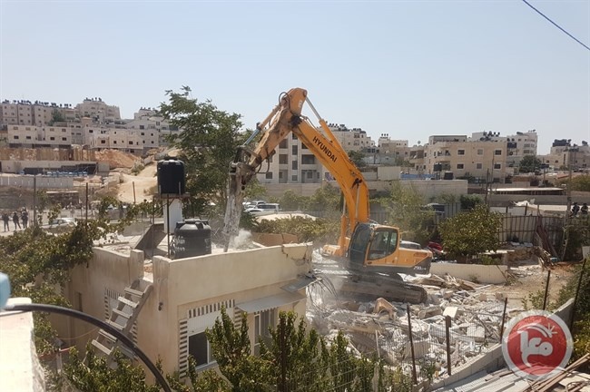 By decisions of the occupation municipality... emptying the contents of one house and demolishing another