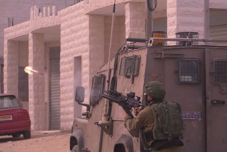 Two young men were injured by live bullets and dozens of suffocated during clashes in Beit Ummar